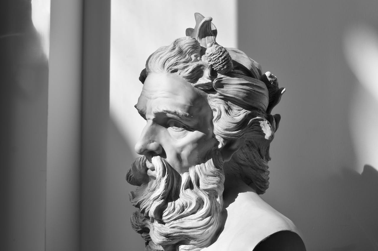 Elegant monochrome photo of a classical stone sculpture with intricate details.